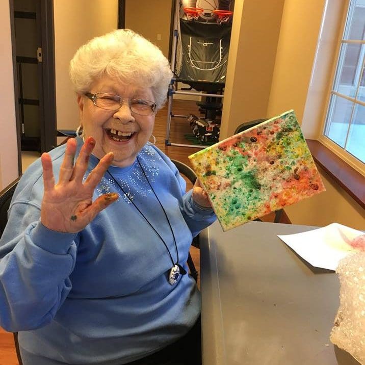 Elderly woman fingerpainting