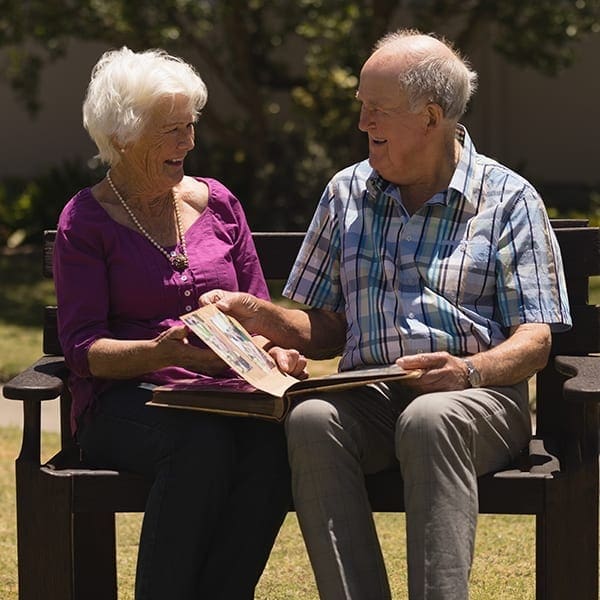 Assisted Living couple on bench