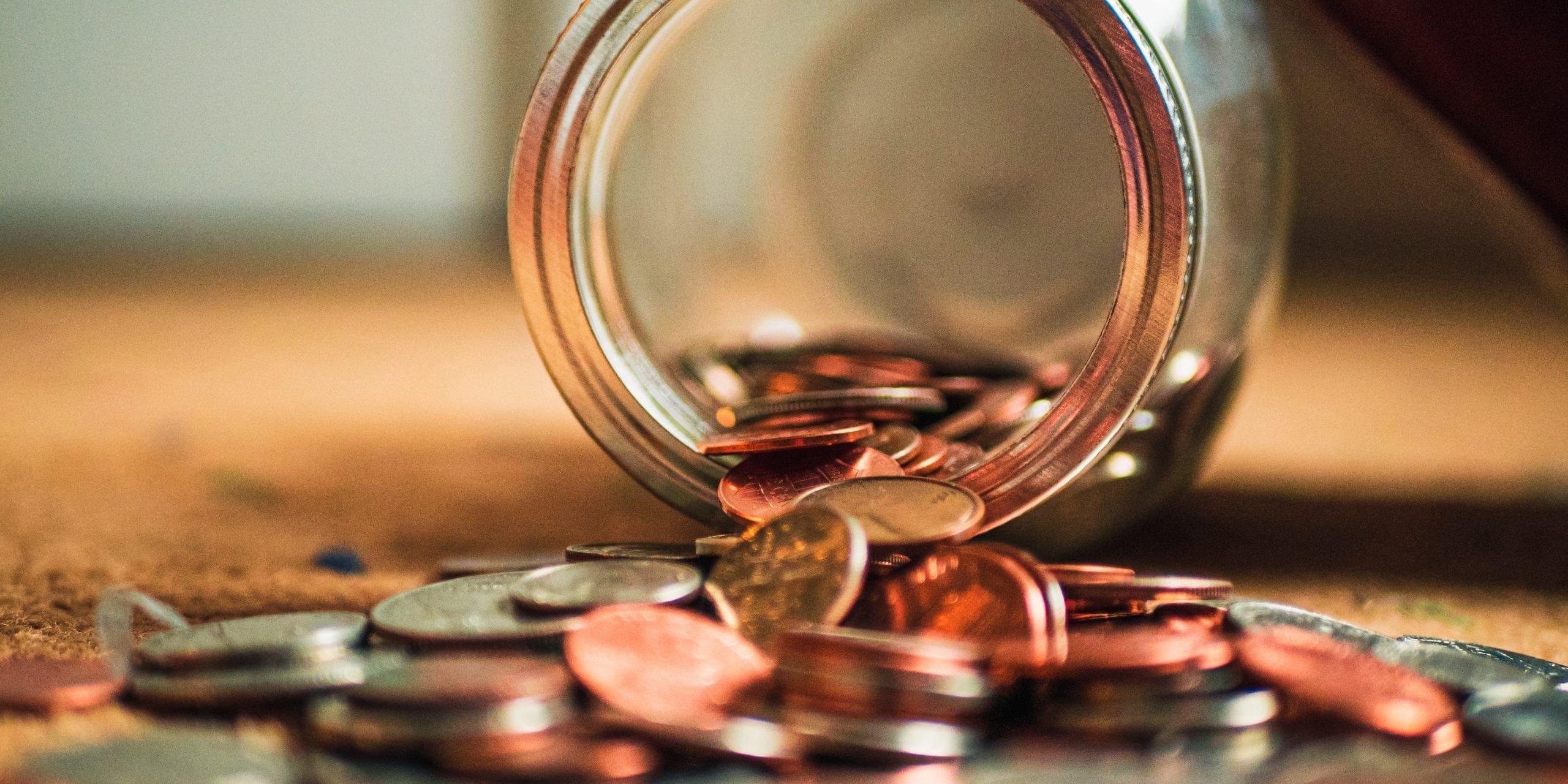 money Money out of tipped over jar