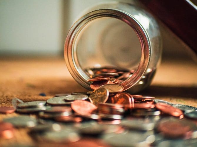 Money out of tipped over jar