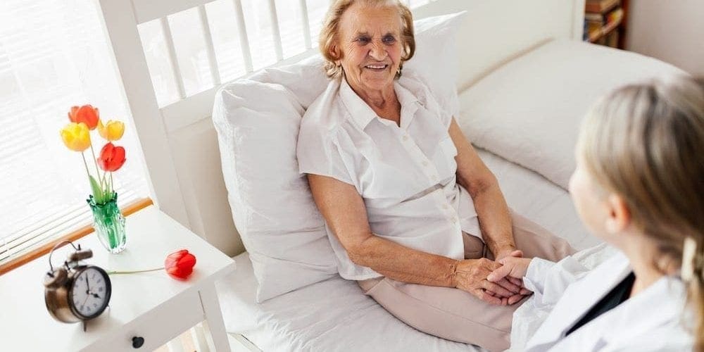 Providing care for elderly. Doctor visiting elderly patient at home. Providing care for elderly. Doctor visiting elderly patient at home.